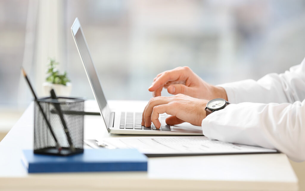 Side view of someone using a laptop