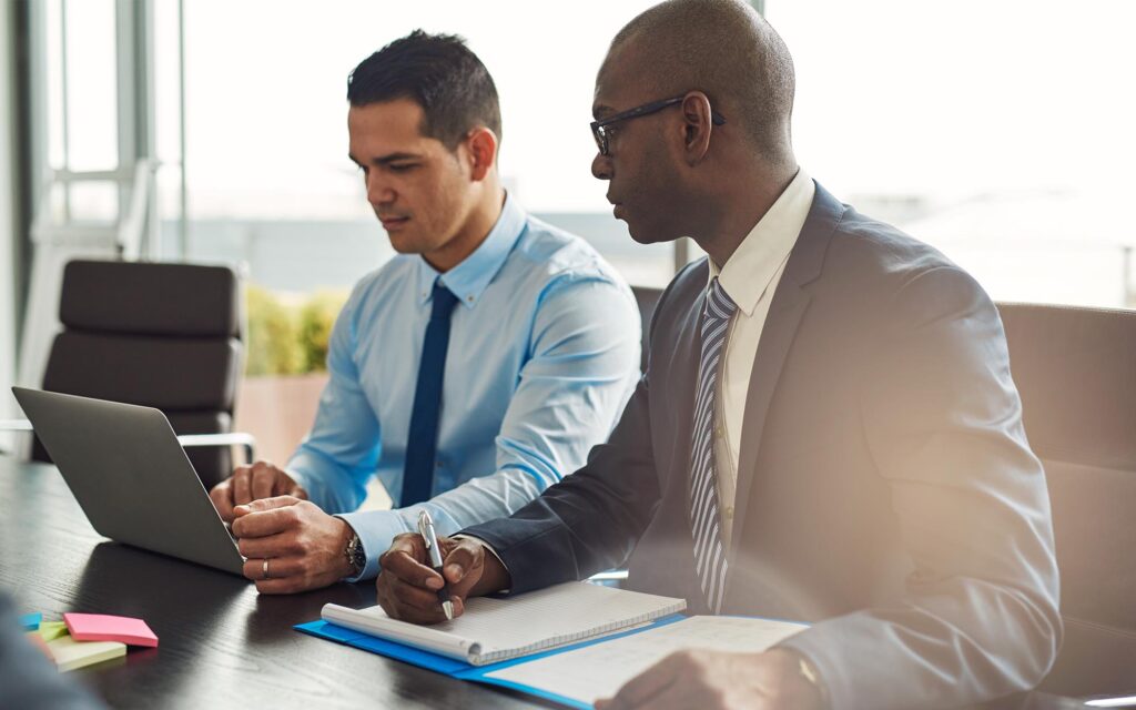 Side view of two experienced business executives in a meeting